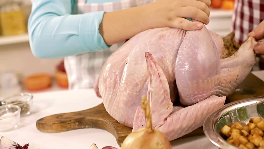 cooking chicken roasted stuffed turkey in kitchen family dinner thanksgiving and christmas holiday