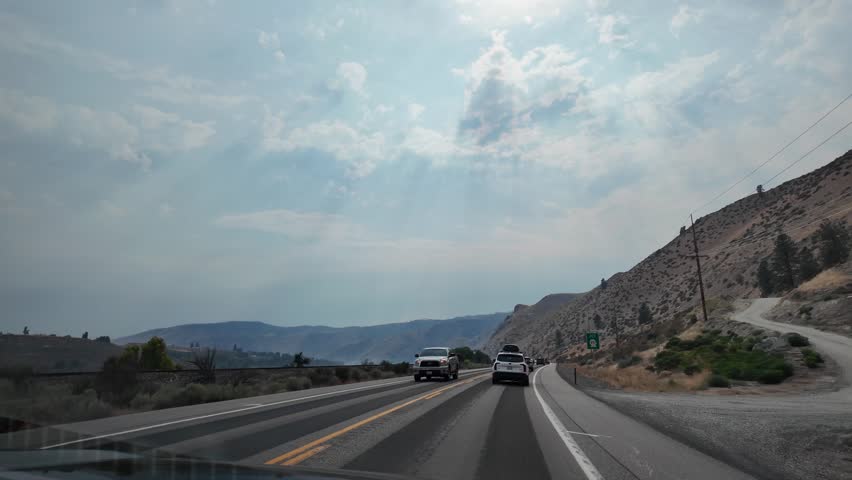 Landscape of mountain and road. Travel destination. Landscape route. Scenic nature autoroute. Rainy weather road among mountain. Road though mountain landscape.