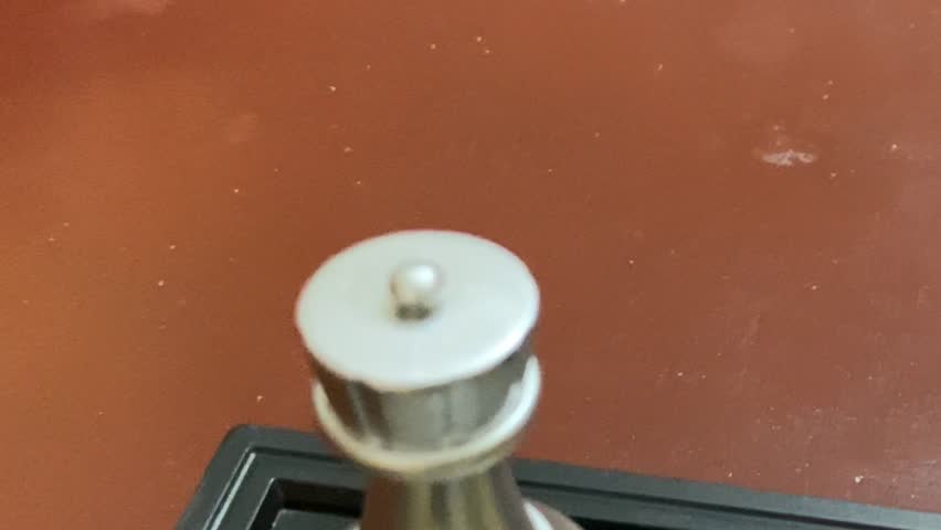 Chess board layout with gold and silver game pieces - close up shot.