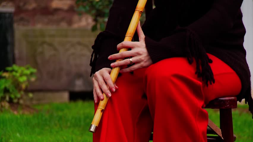 Close Up of Female Hands Playing Traditional Reed Flute Ney