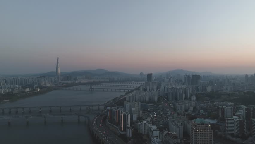 Aerial night view of the illuminated Seoul skyline and Han River from Gwangjin-gu, South Korea