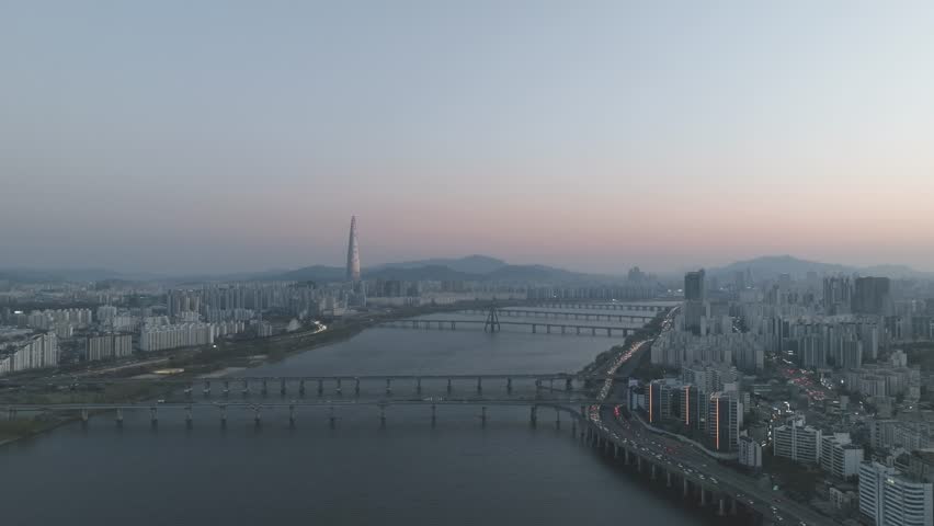 Aerial night view of the illuminated Seoul skyline and Han River from Gwangjin-gu, South Korea