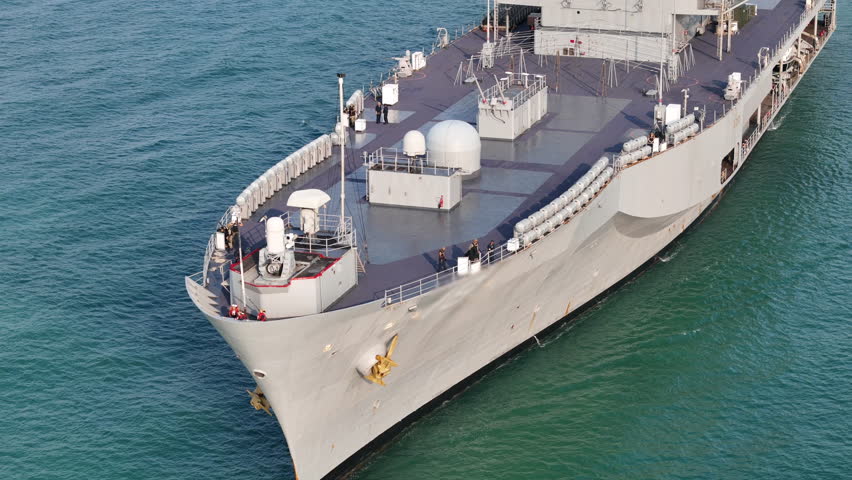 modern naval ship sailing on the open blue ocean. Concept of maritime defense, national security, and military naval infrastructure in a professional setting.