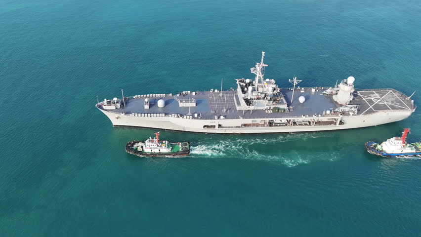modern naval ship sailing on the open blue ocean. Concept of maritime defense, national security, and military naval infrastructure in a professional setting.