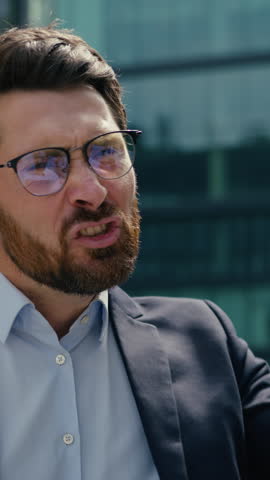 Furious angry Caucasian businessman male boss yelling scolding African American businesswoman female aggressive frustrated workplace conflict problem office bullying corporate stress outside street