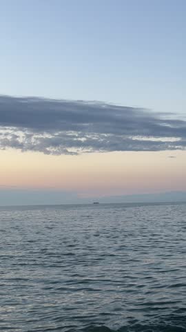 Beautiful sunset seascape from empty sandy beach