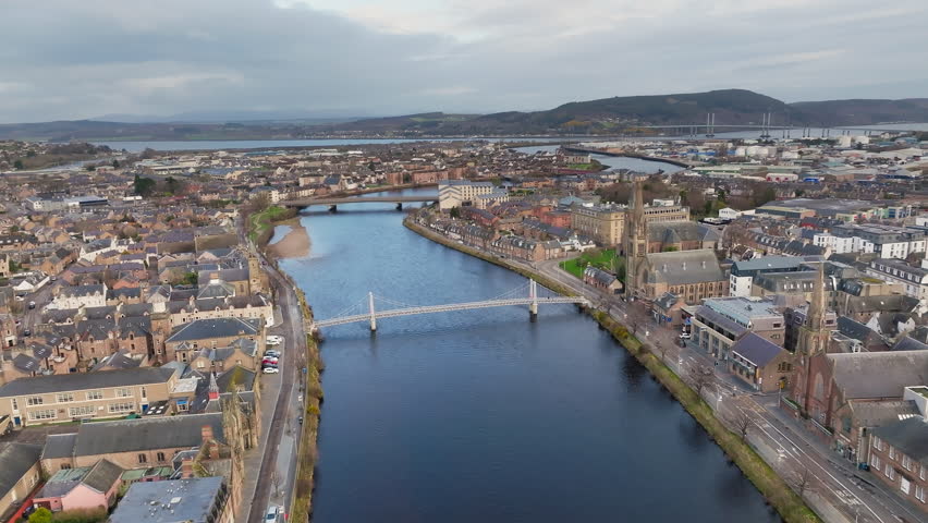 Inverness city in the Scottish Highlands, River Ness flowing through the cityscape, Scotland, Panoramic drone view