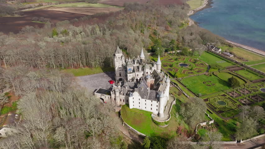 Dunrobin Castle in the Scottish Highlands and its formal gardens overlooking the coast, Aerial panoramic view