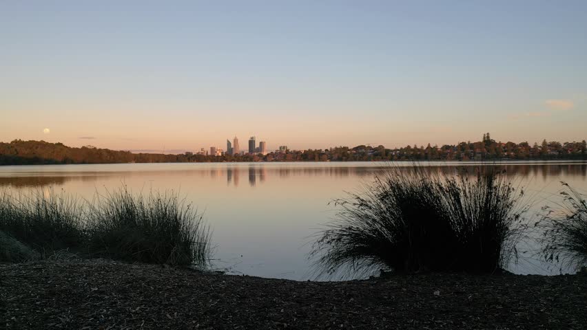 Sunset over Lake Monger next to Perth CBD, Western Australia Aerial Drone 4K