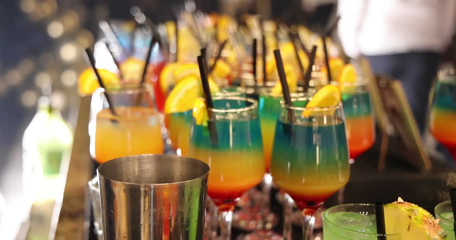 Bartender prepares a colorful Melon Refreshing cocktail at a party, mixing vibrant ingredients to create a refreshing drink that adds energy, fun, and great vibes to the celebration, slow motion