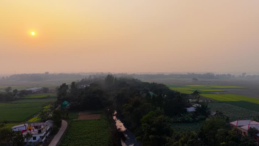 Rural landscape with fields and trees at sunrise or sunset countryside farm agriculture nature green