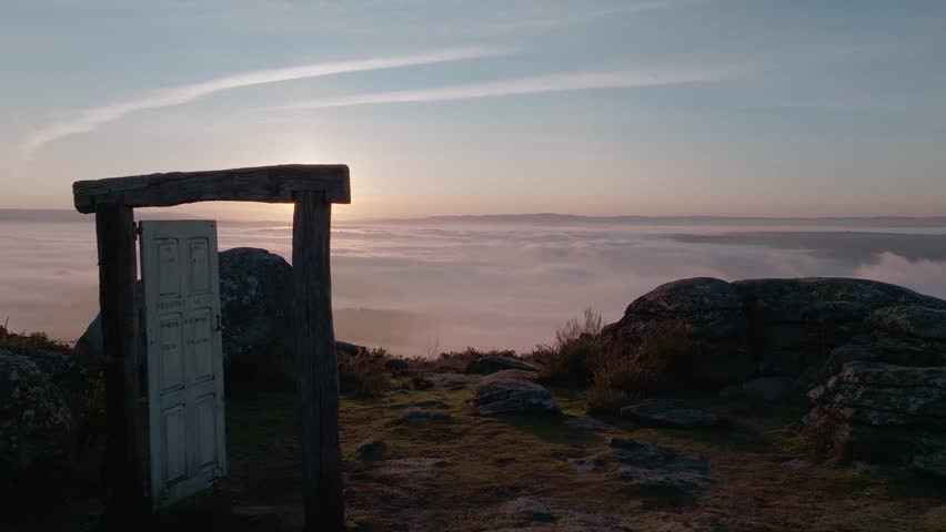 Aeria View Of A Valley Covered By Dense Mist From The Top Of A Mountain