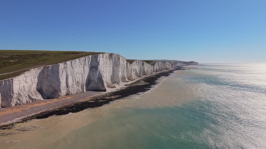 Aerial View of Seven Sisters Cliffs, East Sussex, England. Scenic coastal landscape highlighting natural beauty, rugged shoreline, and one of the UK’s most famous coastal landmarks.