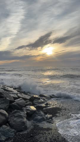 Peaceful ocean sunset from sandy beach shoreline