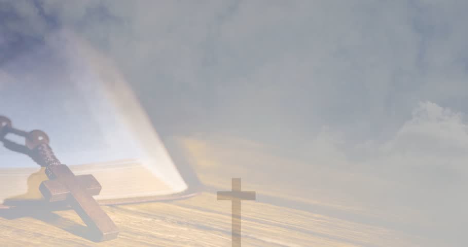Cloud veil lifting cross clearing casting triangle shadow book rosary gaining clarity for devotion. Crucifix, silhouette, stilllife, devotional, contemplation, studio, woodgrain