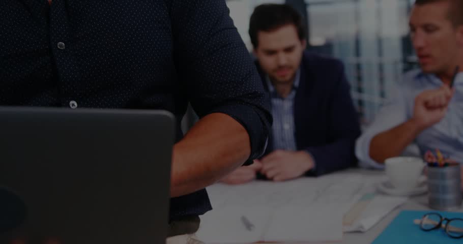 Man typing laptop starting business meeting camera lifting showing green world map overlay covering. Teamwork, strategy, leadership, analytics, data, collaboration, corporate