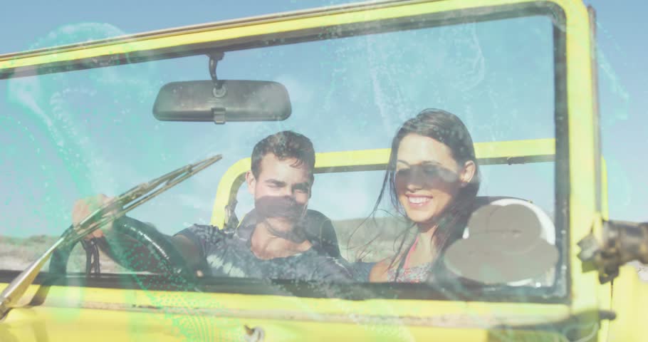 Driver lifting smartphone, couple leaning in yellow jeep, sharing travel content with light leaks. Roadtrip, duo, convertible, adventure, sunny, smiles, windshield