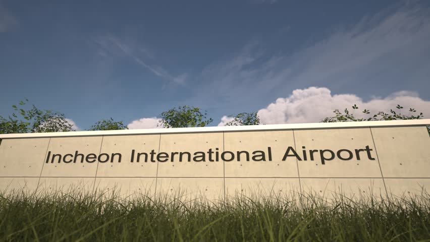 Arrivals at Incheon International Airport with airplane landing near terminal, Seoul, South Korea