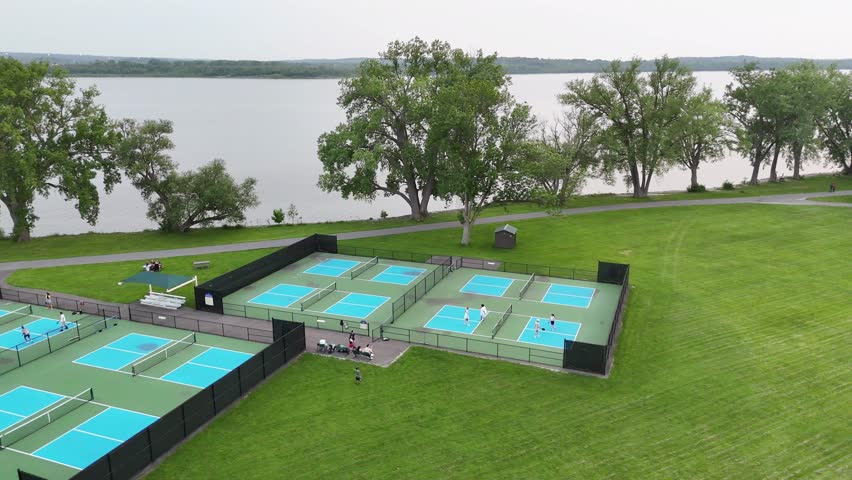 People engaging in and enjoying the amenities that this public park has to offer as it