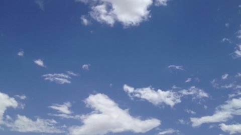 Slow-moving BLUE Sky clouds Puffy fluffy white clouds sky time lapse motion background Bright blue sky cotton puffy fluffy cloud oxygen cloudscape cloudy heaven Storm clouds move fly fast motion time