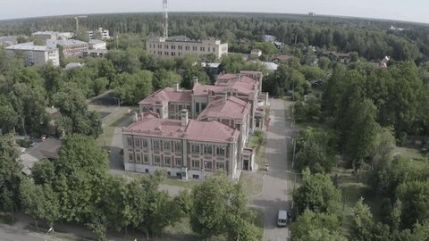 Drone Circling above Historic Building Forest