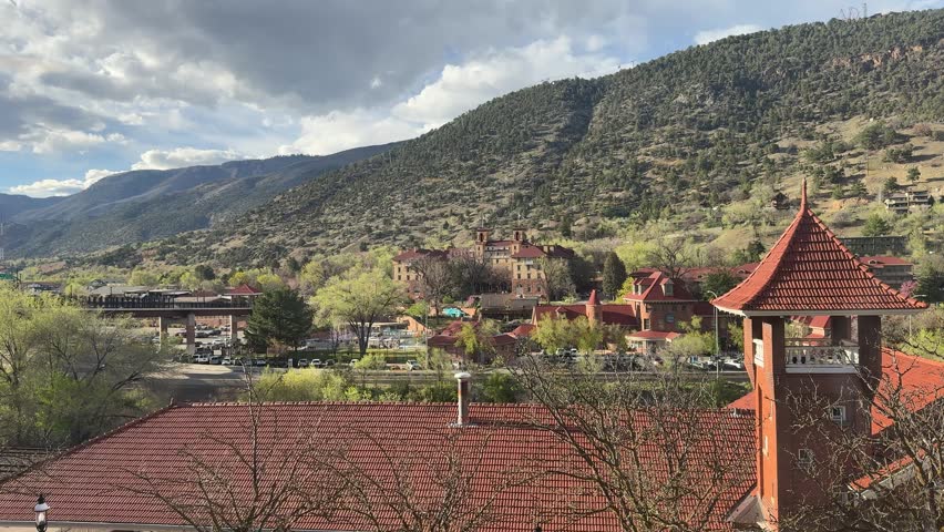 Glenwood Springs in spring and the canyon spirit train arriving in town at Glenwood springs station
