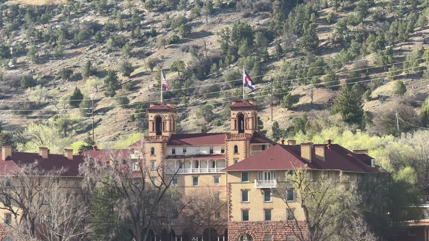 Glenwood Springs in spring and the canyon spirit train arriving in town at Glenwood springs station