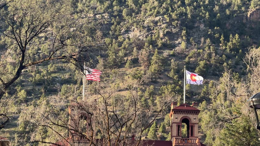 Glenwood Springs in spring and the canyon spirit train arriving in town at Glenwood springs station