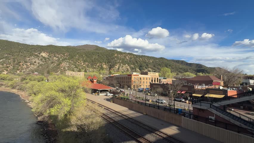 Glenwood Springs in spring and the canyon spirit train arriving in town at Glenwood springs station
