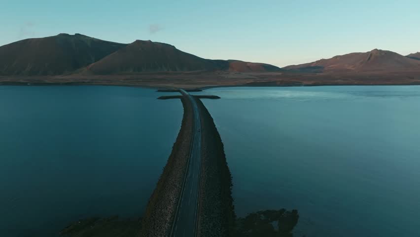 4K Drone Aerial of Iconic Causeway Bridge in Iceland Over Water Cinematic Landscape
