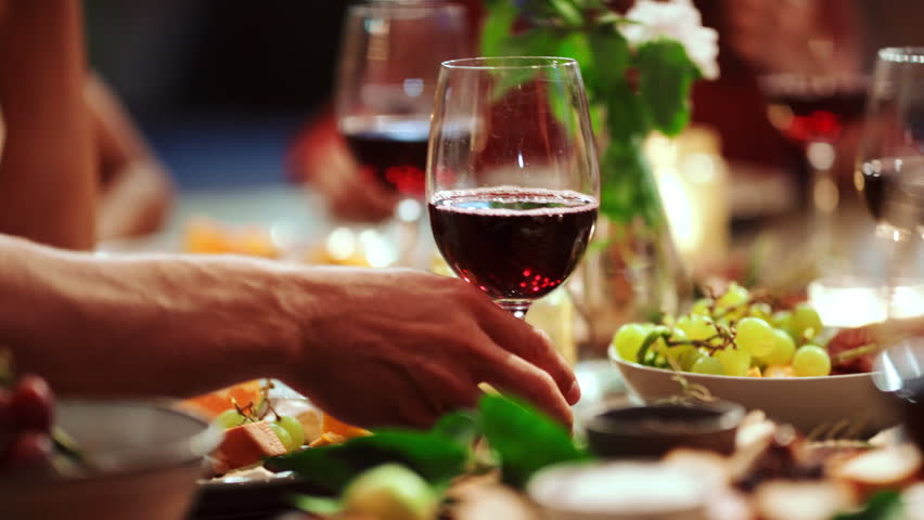 Lunch, cheers and wine with hands of friends for bonding, reunion and summer vacation, chat and hangout. Support, celebration and holiday toast with people on patio of home for party and drink