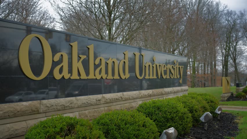 Oakland University in Auburn Hills Michigan Sign in daylight with smooth cinematic motion