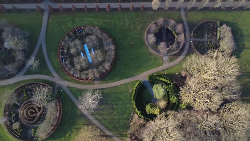Aerial top down view of the circular gardens in Valbyparken Copenhagen on a sunny day during autumn