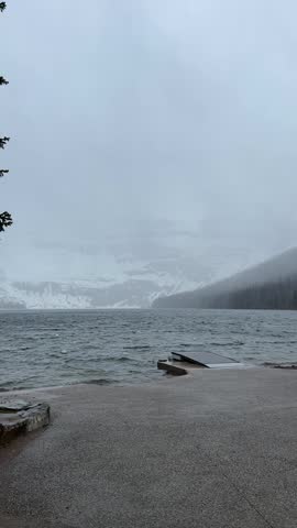 Cameron Lake with snowy mountains in Waterton Lakes National Park