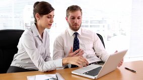 Business people working together on the laptop at desk in office - Powered by Shutterstock - Get 15% off with code: PIKWIZARD15