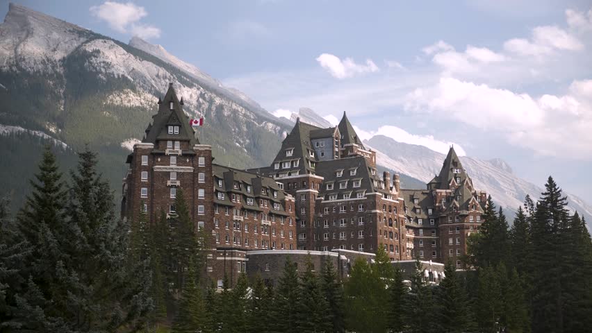Luxury Historic Fairmont Banff Springs Hotel with majestic Mount Ruddle in the background, Banff National Park, Alberta, Canada. Road trip in Canada. Rocky mountains. 