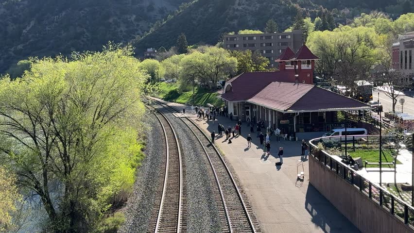 Glenwood Springs in spring and the canyon spirit train arriving in town at Glenwood springs station