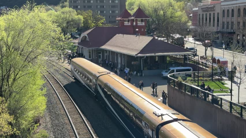 Glenwood Springs in spring and the canyon spirit train arriving in town at Glenwood springs station