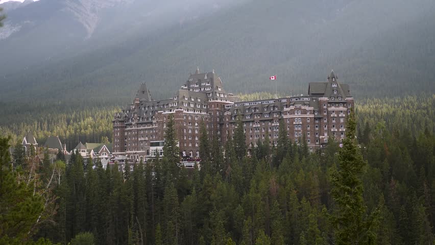 Luxury Historic Fairmont Banff Springs Hotel with majestic Mount Ruddle in the background, Banff National Park, Alberta, Canada. Road trip in Canada. Rocky mountains. 
