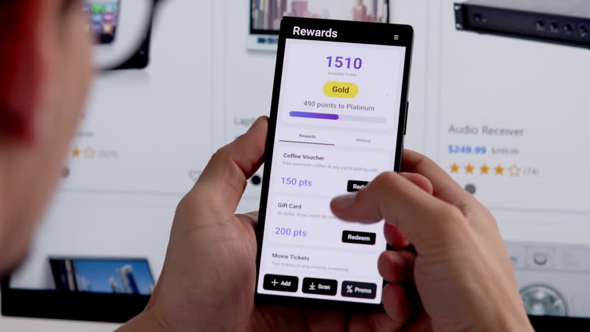 Man Using Loyalty Reward Program App On Phone