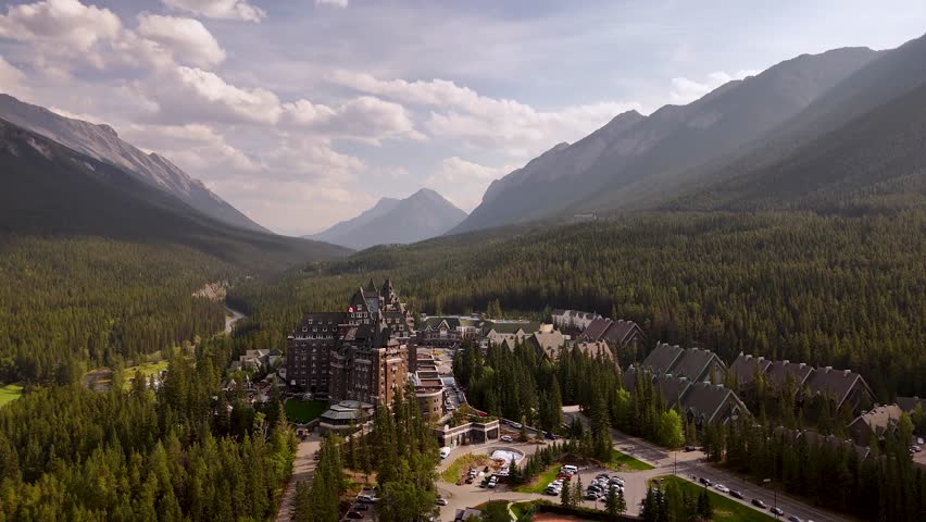 Cinematic drone footage of the historic Fairmont Banff Springs Hotel with majestic Mount Ruddle in the background, Banff National Park, Alberta. Road trip in Canada. Rocky mountains. 4k footage