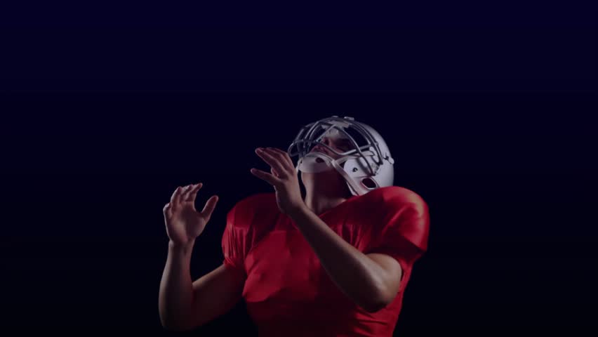 Athlete tracking ball, reaching, catching, securing while sports HUD shows radar and numbers nearby. Football, player, jersey, helmet, pads, overlay, telemetry