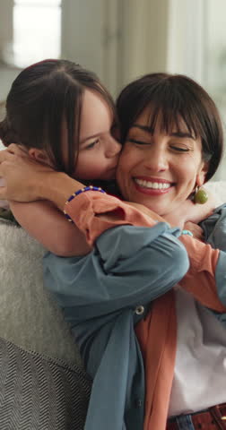 Mom, child and kiss in home for love, relax and hug together with parent for happiness. Mother, girl and embrace in living room with kid for connection, trust and support for care with daughter