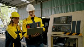 Industrial worker, factory technician using laptop machine control panel manufacturing workshop safety helmet teamwork maintenance with engineer beside machinery, checking control panel operations - Powered by Shutterstock - Get 15% off with code: PIKWIZARD15