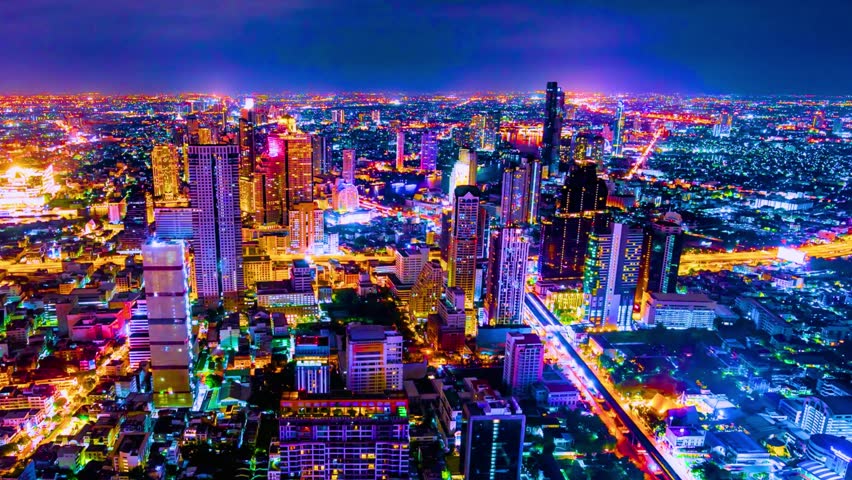 Aerial panoramic view of Bangkok city at night. city lights illuminated buildings and skyscrapers, creating a vibrant and dynamic urban landscape with high-rise structures.