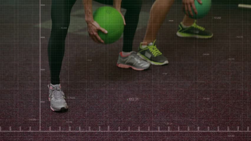 Woman and man pair bracing gripping green balls performing squats in gym with overlay tracking form. Synchronized, partners, core, strength, training, resistance, weights