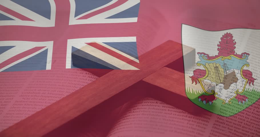 Frame sequence showing red ensign Union Jack fluttering over book with wooden cross, evoking faith. Flag, crest, bermuda, studio, stilllife, overlay, shadow