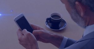 Senior businessman holding phone and swiping at tabletop, starting map overlay showing global links. Smartphone, office, coffee, globe, connectivity, business, professional - Powered by Shutterstock - Get 15% off with code: PIKWIZARD15