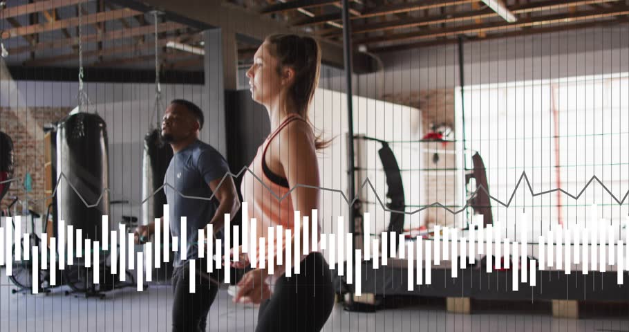 Woman leading, man trailing, turning wrists, jumping ropes in sync for fitness, wave grid over feet. Warehouse, gym, duo, partners, rope, rhythm, coordination