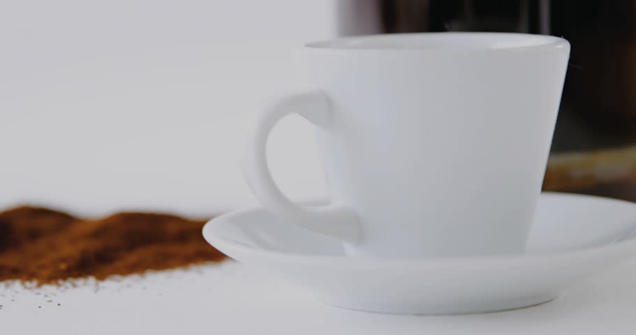 White cup and saucer, overlay fading in over cup driving ring globe progress visualizing data. Coffee, tabletop, closeup, ceramic, kitchen, ui, circular